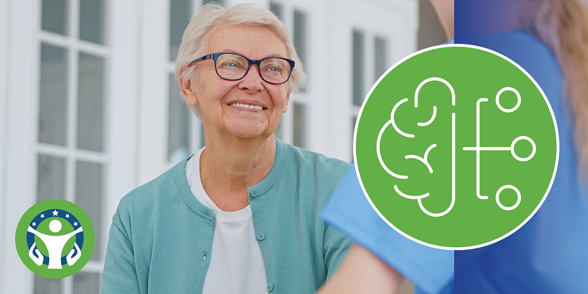 Smiling elderly woman facing toward caregiver