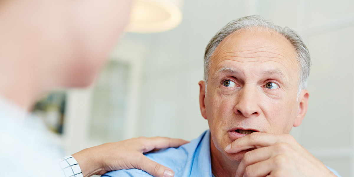 Patient talking with caring clinician