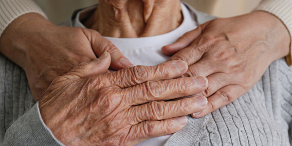 Elderly person being hugged