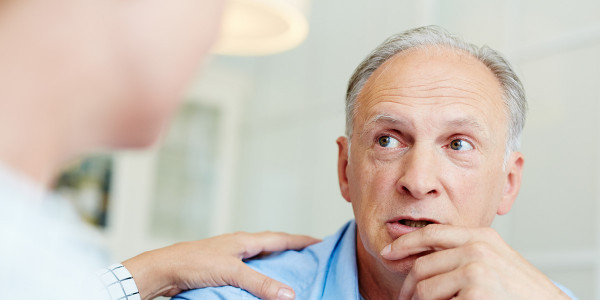 Patient talking with caring clinician