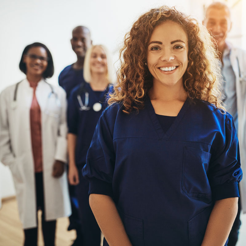 A smiling group of medical professionals